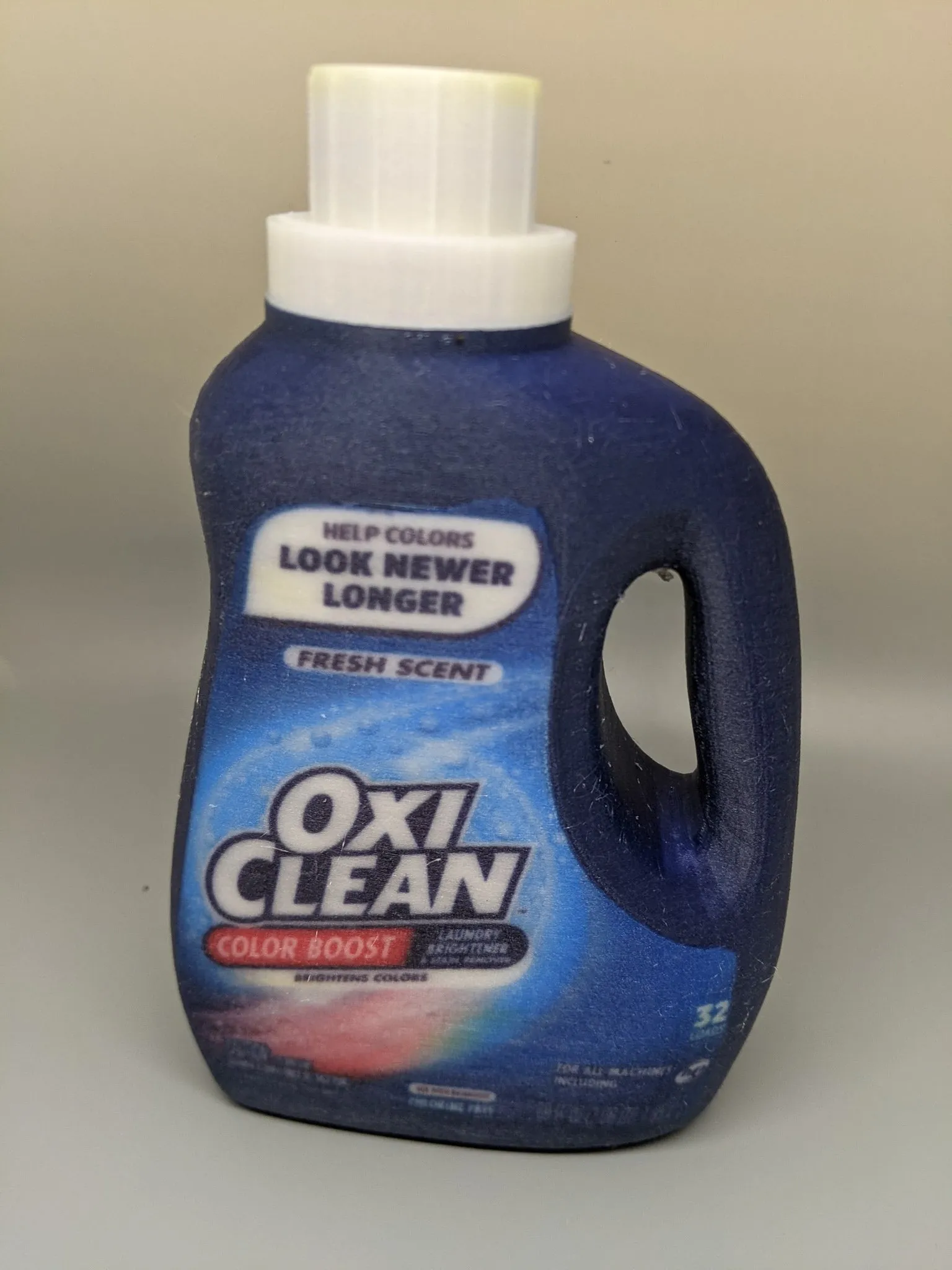 Printed replica of a detergent bottle with full-color label