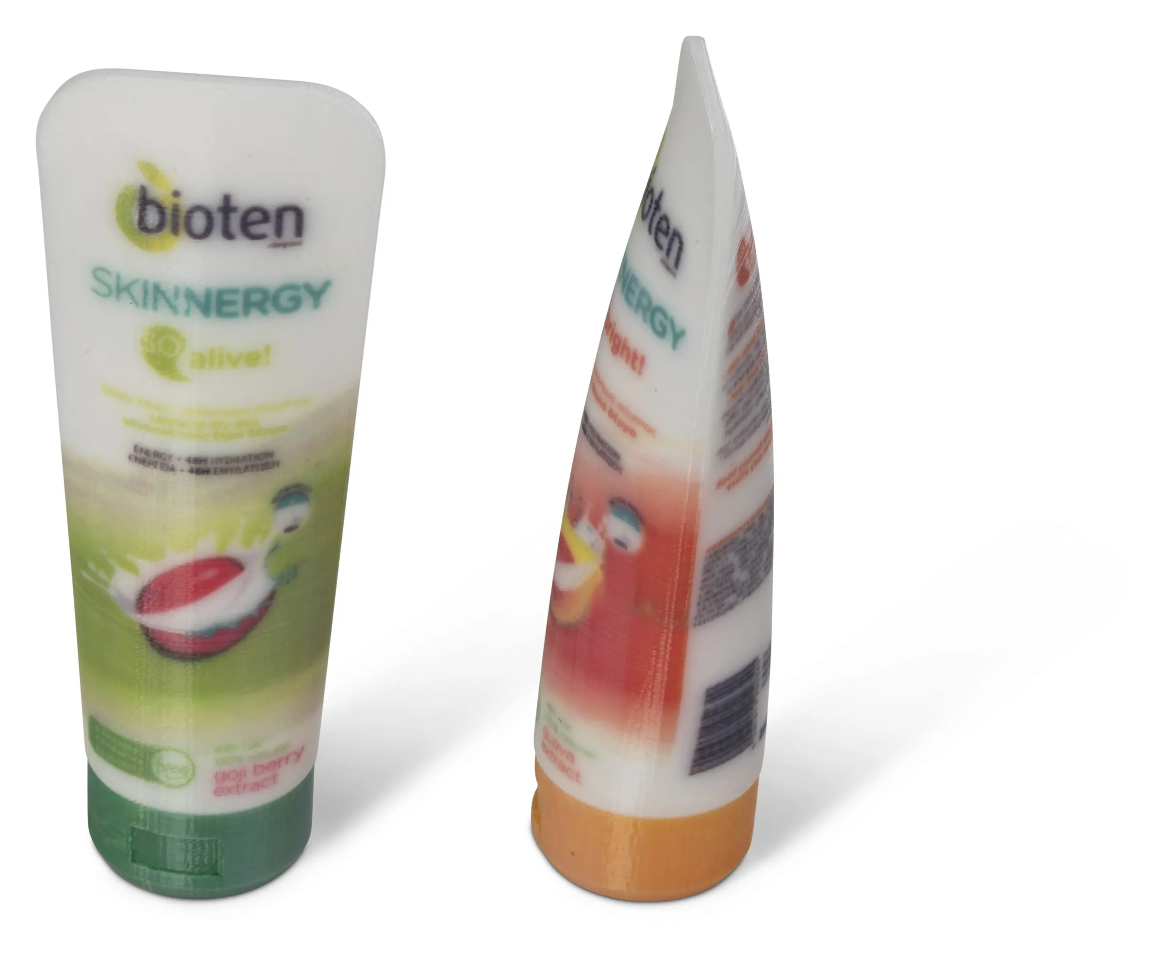 Two printed cosmetic tube prototypes with full-color labels