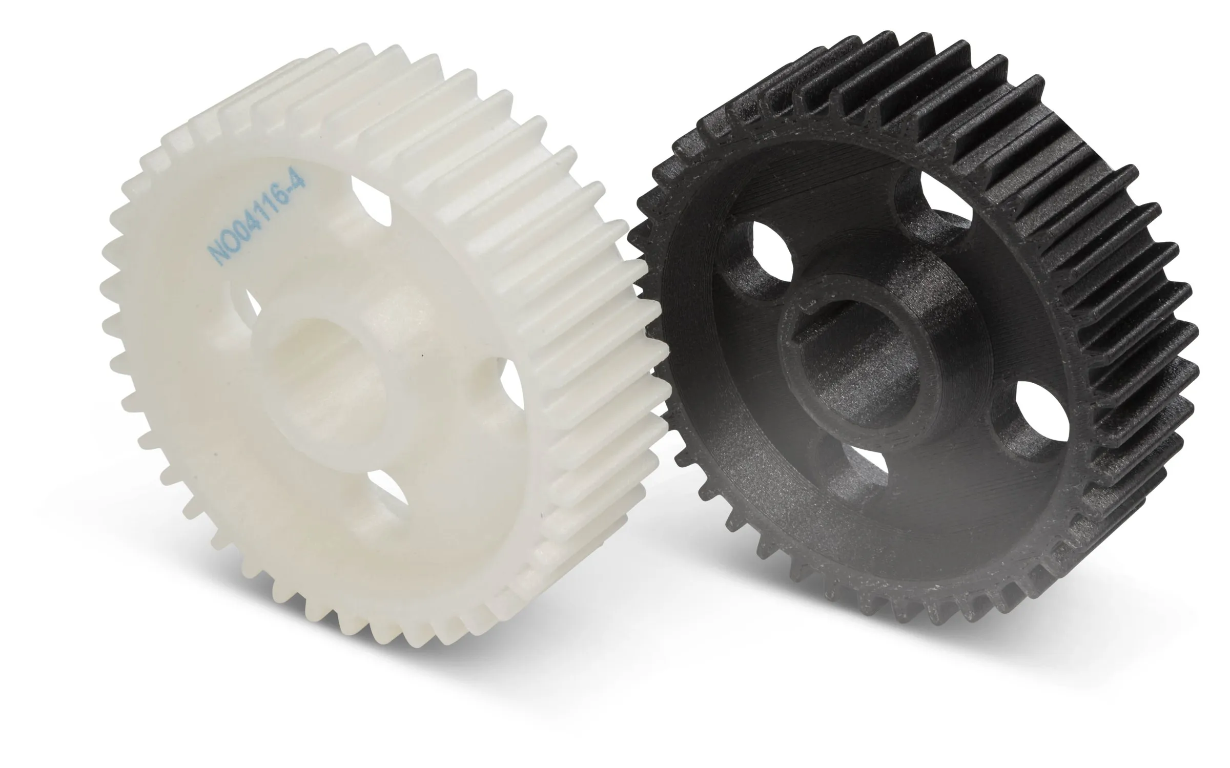 Two gears printed in white and in carbon fiber filled Rizium, with a part number embedded in the white gear